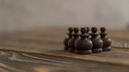 Wooden chess pieces on a chess board for a strategic game