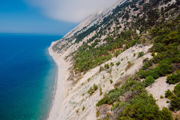 Fototapeta na wymiar Aerial view of coastline with blue sea and highest cliff. Summer day at Black sea