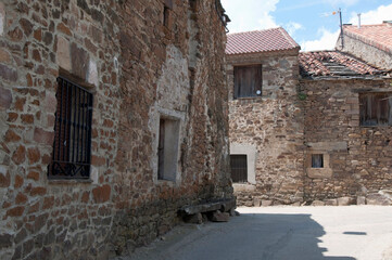 Fototapeta na wymiar Empty street in a rural village. with traditional stone houses. Soria, Castilia, Spain