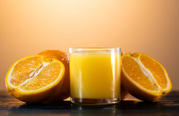 Orange juce, half of orange on the wooden white table. Summer mood. close up shot. raw footage