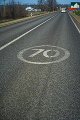 road sign end of speed limit 70 kilometers per hour