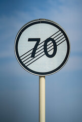 road sign end of speed limit 70 kilometers per hour