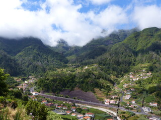 Fototapeta na wymiar Top view of the village Sao Vicente in Madeira, surrounded by mountains. 