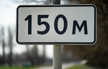 Road sign end of main road. road sign give way. 150 metres to crossroad.