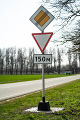 Road sign end of main road. road sign give way