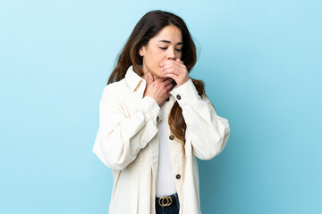 Woman over isolated background coughing a lot