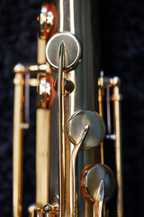 Saxophone jazz instruments. Alto sax isolated. Saxophone music instrument closeup on black                              