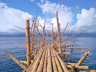 Fototapeta na wymiar wooden poles in the sea