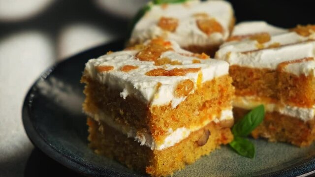 Carrot dessert cake on a plate on a black background. A copyspace.