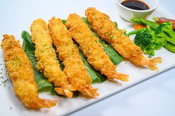 Fried shrimps and vegetables with white background
