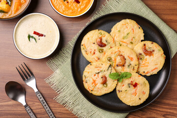 South Indian breakfast rava idli or semolina idly , Suji idly with coconut chutney. Very popular dish in Kerala, Tamil Nadu, India , Sri Lanka.  healthy Steamed food 