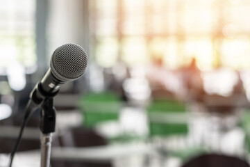 Microphone voice speaker in business seminar, speech presentation, town hall meeting, lecture hall...