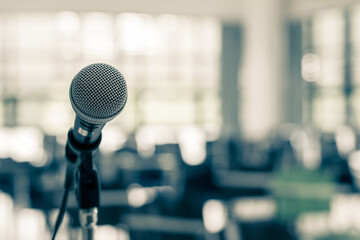 Microphone voice speaker in business seminar, speech presentation, town hall meeting, lecture hall or conference room in corporate or community event for host or townhall public hearing - obrazy, fototapety, plakaty