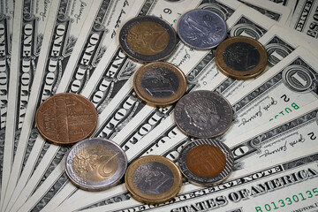 The figure from coins of different countries on a background of money. Layer of dollars  Cash. Green background. American money. Iron silver round coin                               