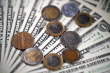 The figure from coins of different countries on a background of money. Layer of dollars  Cash. Green background. American money. Iron silver round coin                               