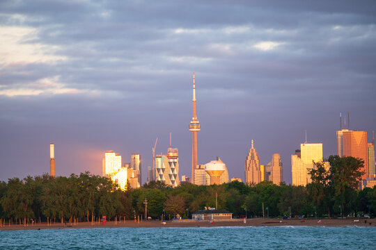 Looking west from the Kew Beach Dog park in Toronto's Beaches neighbourhood across Ashbridges Bay toward the downtown skyline and the CN Tower as the sun rises..