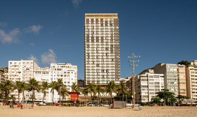  On Avenida Atlantica people go in for outdoor activities. Moving vehicles