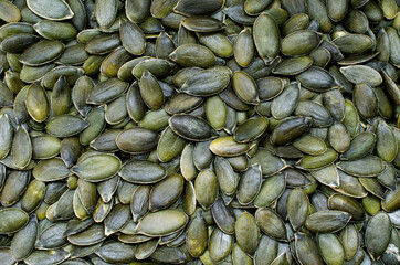 Dry organic pumpkin seeds background