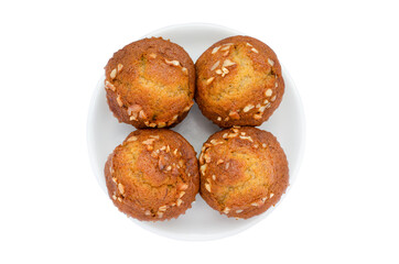 Four pieces of fresh delicious homemade banana cup cake in white dish isolated on white background, ready to serve