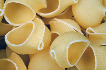 Spiral pasta background. Close-up of raw spaghetti, italian food. Garnish. Flour products. Paste.                           