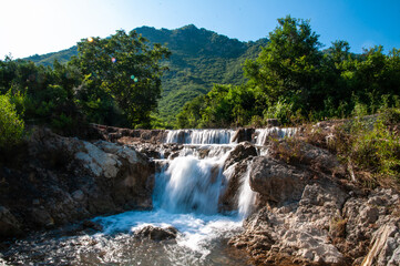 Fototapeta na wymiar green forest and river waterfalls, in the mountains of Islamabad, Kalagar Village, Margalla mountains