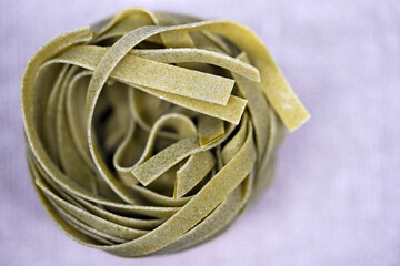 Spiral pasta background. Close-up of raw spaghetti, italian food. Garnish. Flour products. Paste.                           