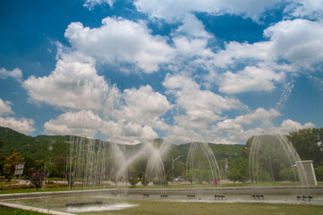 9th avenue highway road, Islamabad, fountains running, margalla hills in front, margalla road