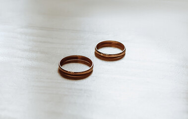 Man and woman couple of newlyweds hold hands with rings in a cafe with a cup of coffee. The bride...