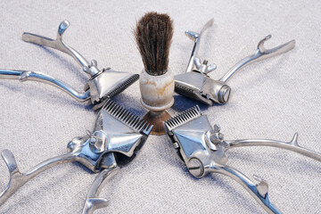 Tool details. Barbershop. Hair clipper on a canvas background top view. Blades                               