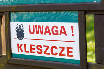Attention Ticks, Information board with a warning notification in Polish