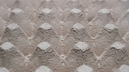 The egg tray is used as a background.