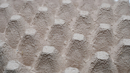 The egg tray is used as a background.