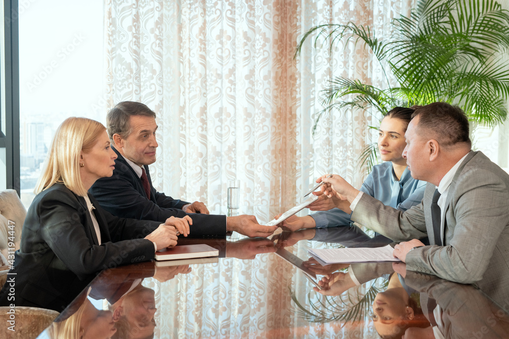 Poster a group of people sitting around a table and having discussion