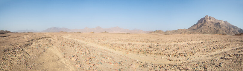 Barren rocky desert landscape in hot climate