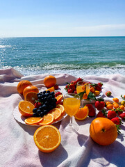 fresh fruit  at the  beach. Fruits in the sun. Summer time beach concept of healthy eating