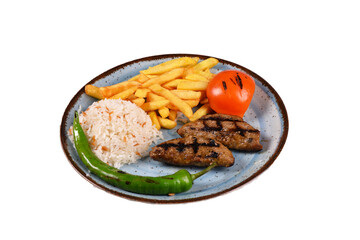 grilled turkish meatballs rice tomato and french fries. Turkish cuisine traditional Turkish food. fried meatballs. on a white background