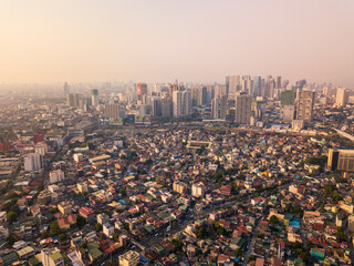 Metro Manila, Philippines - Late afternoon aerial, North Makati, Mandaluyong and Ortigas cityscape.