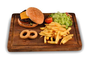 Homemade cheeseburger, french fries and onion rings. Cheeseburger on wooden presentation plate. white background
