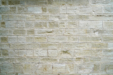 Stone wall bricked with strong structure, photographed in daylight