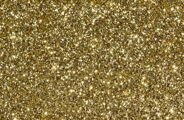 Golden glitter background with sparkles and copy space, one color full frame image.