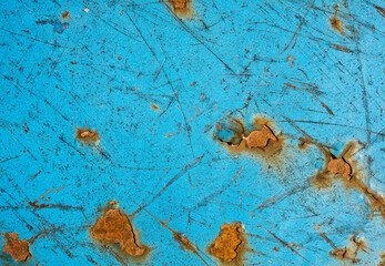 Rusty metal. The old wall. Diffused paint. Blue color.