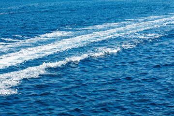 Fototapeta na wymiar Boat tail on sea water . Summer vacation sailing cruise . Trail on the blue water 