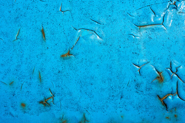 Rusty metal. The old wall. Diffused paint. Blue color.
