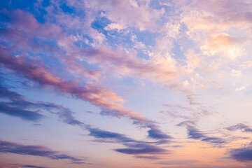 Naklejka na ściany i meble View of of sky. Orange blue and violet color sunset sky background.