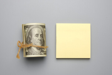 A picture of fake cash and copyspace notepad