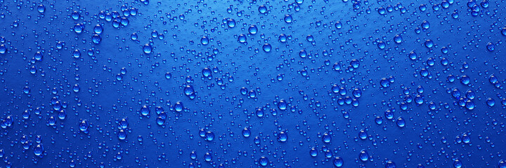 A lot of water droplets On metal or metalic surfaces in blue and dark blue shades for mobile background or wallpaper. 3D Rendering.