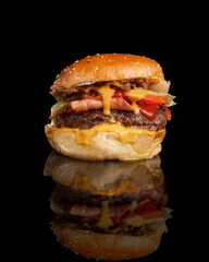 burger with cheddar bacon in a black background