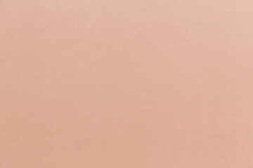 ฺBrown wall texture. Texture of the wall for background. Brown wall soft light background. The structure of an old brown cement surface. Flesh color