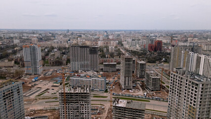 Construction site with multi-storey buildings under construction. Modern urban development. Aerial photography.
