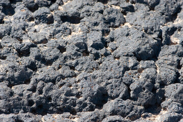 Close-up grunge black stone or rock structure on deserted island Fuerteventura